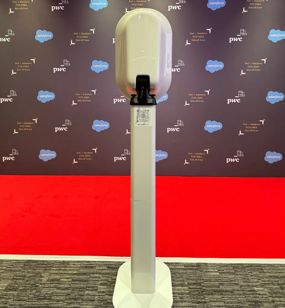 The In Flow booth on a red carpet in front of a PwC and Salesforce backdrop