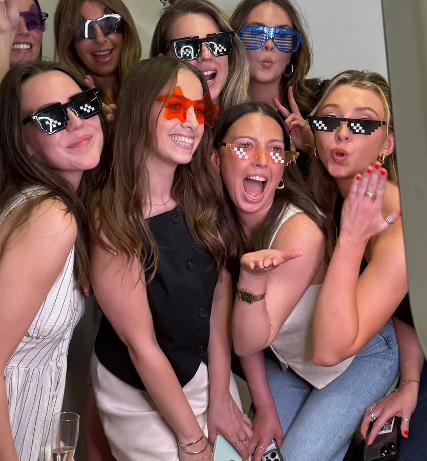 A big group of friends in party glasses