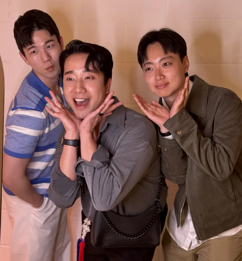 Three friends striking poses